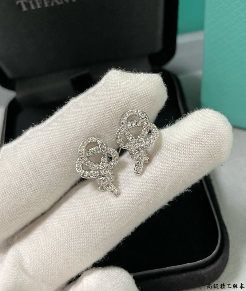 T*f*ny earrings